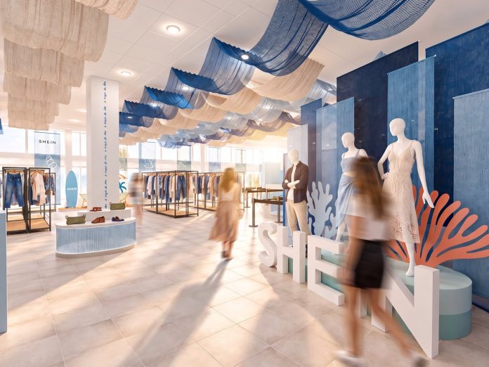 Projeto da loja temporária da SHEIN com araras de roupas, manequins e decoração em tons de azul